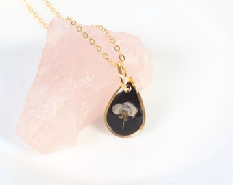 Tiny gold pressed flower necklace, natural white flower, handmade resin pendant, black, botanical jewelry, small, dainty, wildflower, plant
