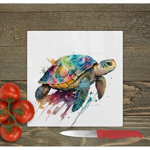 May include: A colourful watercolour painting of a sea turtle on a white background. The turtle is painted in shades of blue, green, yellow, and orange. The background is splattered with paint.