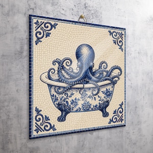 May include: A square wall art piece featuring a mosaic-style illustration of a blue octopus sitting inside a clawfoot bathtub. The design includes intricate blue floral patterns on the tub and decorative scrollwork in the corners on a cream background.