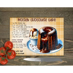 May include: A yellow and brown chequered chopping board with a recipe for molten chocolate cake. The recipe includes ingredients such as dark chocolate chips, unsalted butter, eggs, and flour. The image also shows a chocolate cake with a molten chocolate centre, topped with vanilla ice cream.