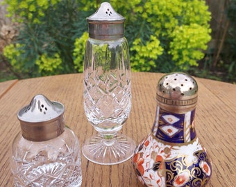 Selection of Vintage Salt Shakers. Vintage Ceramic Royal Albert Salt Shaker. Crystal Salt Shakers with Silver Plated Rims and Lids.