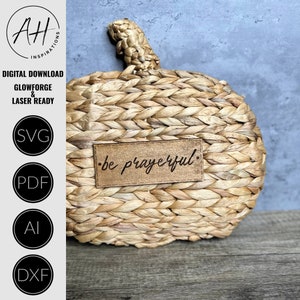 May include: A woven pumpkin with a brown leather tag that says "be prayerful".