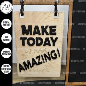 May include: A wooden sign with the text "Make Today Amazing!" in black lettering. The sign is hanging from a string and has a starburst design around the word "Amazing!"