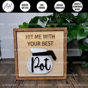 May include: A wooden sign with a coffee pot design and the text "Hit me with your best pot". The sign is surrounded by a brown frame with a coffee bean pattern.