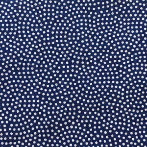 May include: A blue fabric with a white polka dot pattern.