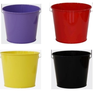 May include: Four metal buckets in different colors: purple, red, yellow, and black. Each bucket has a handle.