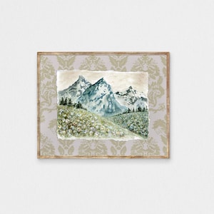 May include: A watercolor painting of a mountain range with snow-capped peaks and a green valley in the foreground. The painting is framed in a gold-colored frame with a decorative pattern.