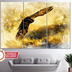 May include: A watercolor painting of a golden eagle in flight against a yellow and brown background with white speckles.