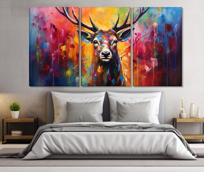 May include: A colourful abstract painting of a deer with large antlers. The background is a mix of vibrant colours, including blue, red, yellow, and green.