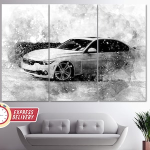 May include: A black and white abstract art print of a silver car with a watercolor effect. The car is driving on a road with a white background. The print is divided into three panels.