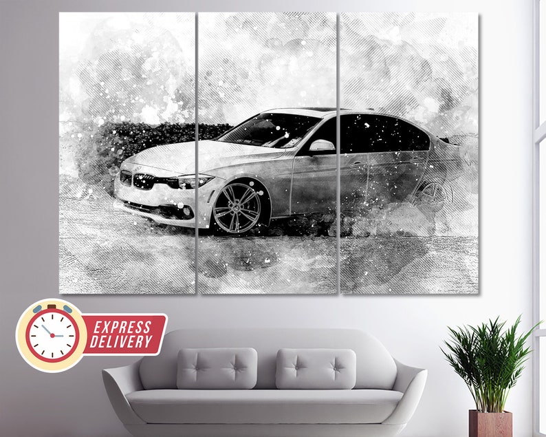 May include: A black and white abstract art print of a silver car with a watercolor effect. The car is driving on a road with a white background. The print is divided into three panels.