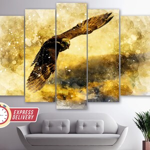 May include: A multi-panel canvas print featuring a watercolor painting of a golden eagle in flight against a yellow and brown background.