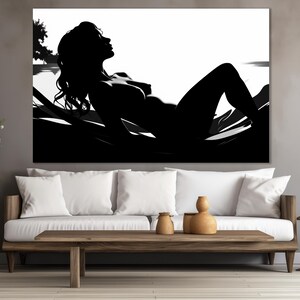 May include: Black and white silhouette of a person lying down on a bed of leaves. The person's hair is long and flowing, and their body is relaxed and at ease. The image is simple and elegant, and it evokes a sense of peace and tranquility.