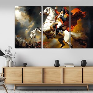 May include: A three-panel canvas print depicting a man on horseback. The man is wearing a red and white uniform and a bicorne hat. The horse is white and is rearing up on its hind legs. The background is a dramatic sky with clouds.