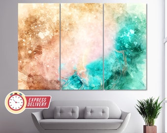 Puede incluir: Impresión de arte abstracto con un diseño de tres paneles. Los paneles presentan una mezcla de colores acuarela marrón claro, melocotón y turquesa con un sutil efecto brillante.