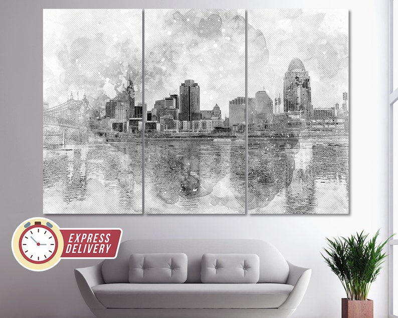 May include: A black and white watercolor painting of a city skyline with a bridge in the foreground. The city is reflected in the water below. The painting has a textured, brushstroke effect.