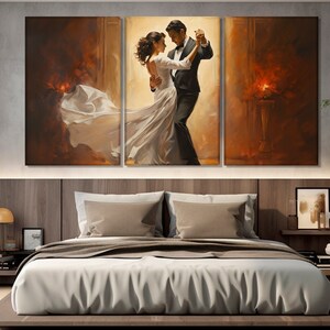 May include: A painting of a couple dancing in a ballroom. The man is wearing a black tuxedo and the woman is wearing a white gown. The background is a warm, golden color.