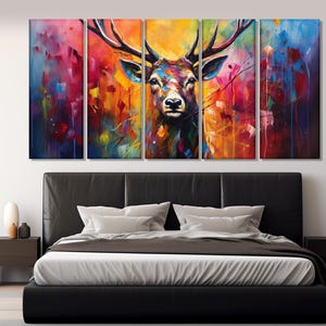 May include: A multi-panel canvas print featuring a colourful abstract painting of a deer's head with large antlers. The background is a vibrant mix of colours, including red, orange, yellow, green, blue, and purple.