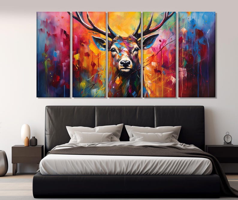 May include: A multi-panel canvas print featuring a colourful abstract painting of a deer's head with large antlers. The background is a vibrant mix of colours, including red, orange, yellow, green, blue, and purple.
