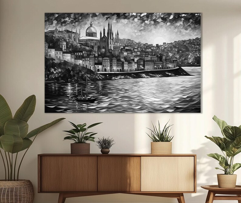 K&ouml;nnte beinhalten: Ein Schwarzwei&szlig;bild einer Stadtlandschaft mit einer Kirche im Zentrum. Die Stadt liegt auf einem H&uuml;gel mit Blick auf ein Gew&auml;sser. Ein kleines Boot befindet sich im Wasser.
