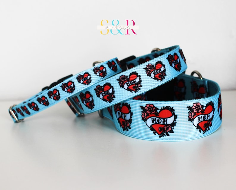 May include: Three blue dog collars with a red heart and the word "MOM" in a tattoo style design. The collars are made of a soft, durable material and are available in a variety of sizes.