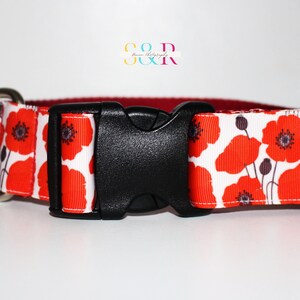 May include: Red poppy flower print dog collar with a black plastic buckle and silver D-ring.