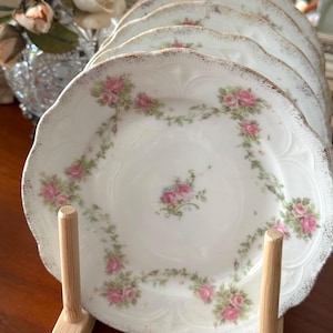 7 beautiful fine porcelain bread plates. Vintage French. Early 20th century.