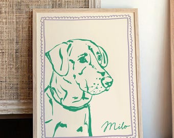 Peut inclure: Une impression encadrée d'un dessin au trait vert d'une tête de chien avec le nom "Milo" écrit en cursive sous l'image. Le cadre est en bois clair et a une bordure violette et blanche.