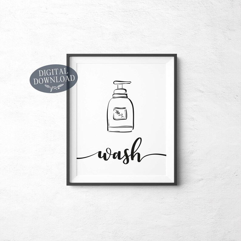 May include: Black and white printable wall art with a simple line drawing of a soap bottle and the word "wash" in a script font.