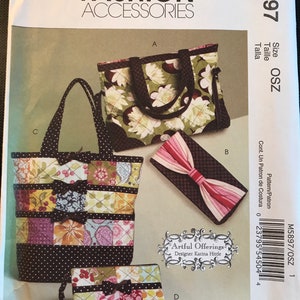 May include: McCall's Fashion Accessories pattern featuring a tote bag, a clutch, and a small wallet. The tote bag has a patchwork design with bows. The clutch has a bow design. The wallet has a patchwork design with a bow. The pattern is designed by Karina Hittle.