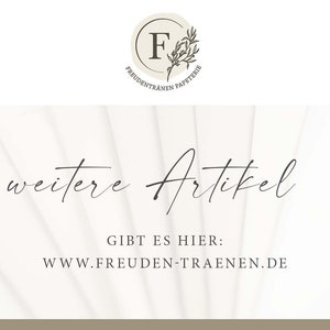 Op de afbeelding: Witte achtergrond met de tekst "weitere Artikel" en het websiteadres "www.freuden-traenen.de" eronder. De tekst "GIBT ES HIER" staat boven het websiteadres.