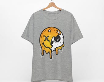Camiseta con calavera sonriente derretida / Camiseta gráfica con emoji goteando