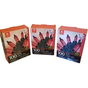 May include: Three boxes of red mini light sets. Each box features a picture of the lights, a black wire, and the text "100 MINI LIGHT SET". The boxes are orange and have the letter "R" on them.