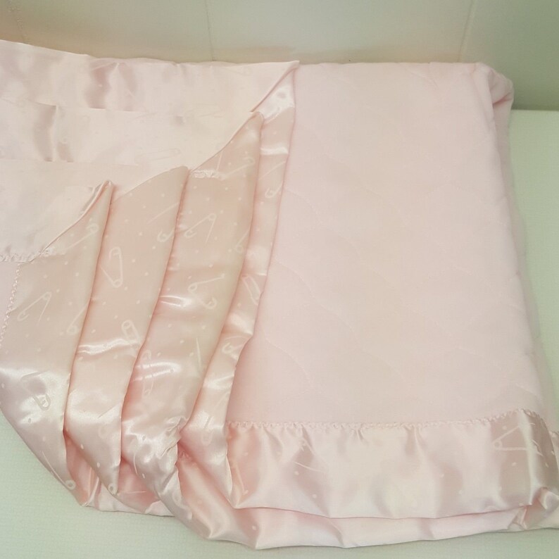 pink baby blanket with satin trim