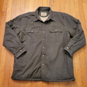 May include: A set of three ceramic mugs with a speckled, matte finish. Each mug features a different color: light blue, cream, and gray. The mugs have a simple, modern design and a comfortable handle.