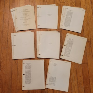 May include: A collection of vintage pamphlets and booklets, likely religious texts, with cream-colored covers and pages. Titles include "The New Testament," "According to John," and "The Acts." The pages are held together with staples.