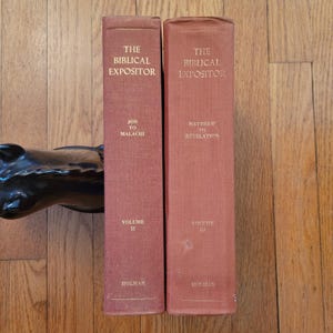 May include: Two vintage books, "The Biblical Expositor," in a reddish-brown hue. Volume II covers Job to Malachi, and Volume III covers Matthew to Revelation. The books are from the Holman publishing house.