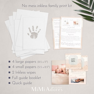 May include: Inkless printing kit for making hand and footprint keepsakes. The kit includes four large papers (8.5 x 11 inches), four small papers (5.5 x 8.5 inches), two inkless wipes, a full guide booklet, and a quick guide. The kit is packaged in a pink and white box with the text "MiMi Adores" printed on it.