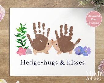 May include: Printable art featuring two brown hedgehogs made with handprints, surrounded by green leaves, pink flowers, and purple flowers. The text "Hedge-hugs & kisses" is written in blue below the hedgehogs.
