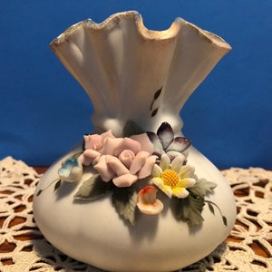 ESD Japan Handpainted China vase with sculptured flowers and trimmed in gold.  Excellent condition.  4&quot; wide and 4.5&quot; tall