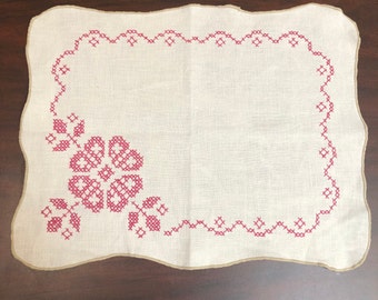 Vintage Linen Table Scarf / Mat with Deep Rose Color Hand Cross Stitching.  Edges finished in tan overstitching. 12" x 15"