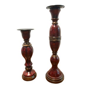 Set Of Two Red and Black Decorative Candlestick Holders With Bronze Accents 16&quot; and 12&quot; tall