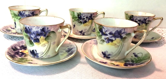 Rare Antique Nippon Hand Painted China Teacups & Saucers. Circa 1940's Violet, green and yellow with gold trim. Set of 5.  Good condition.
