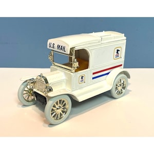 May include: A set of three ceramic mugs with a speckled, matte finish. Each mug features a different color: light blue, cream, and gray. The mugs have a simple, modern design with a rounded shape and a comfortable handle.