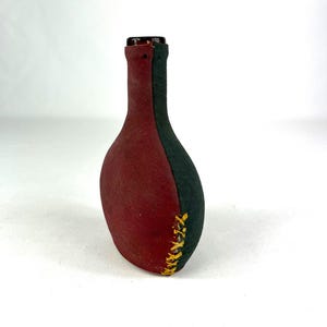 Blown Amber Colored Glass Bottle Wrapped in Hand Made Leather Cover, Burgundy and Green.  2&quot; x 4&quot; x 5.25&quot; tall