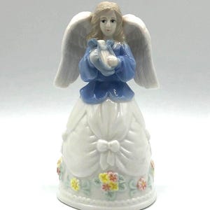 Porcelain Angel Bell Dressed in White and Blue, Holding a Harp.  Bows on her gown and pastel flowers. 3&quot; x 5.5&quot; tall.  Beautiful!