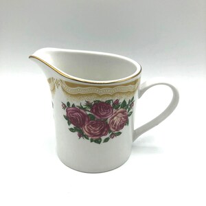 Vintage Creamer Sydney Rose pattern by Farberware.  Burgundy Roses and Green Leaves with a Tan Lacy Scroll border at the rim with gold Trim.