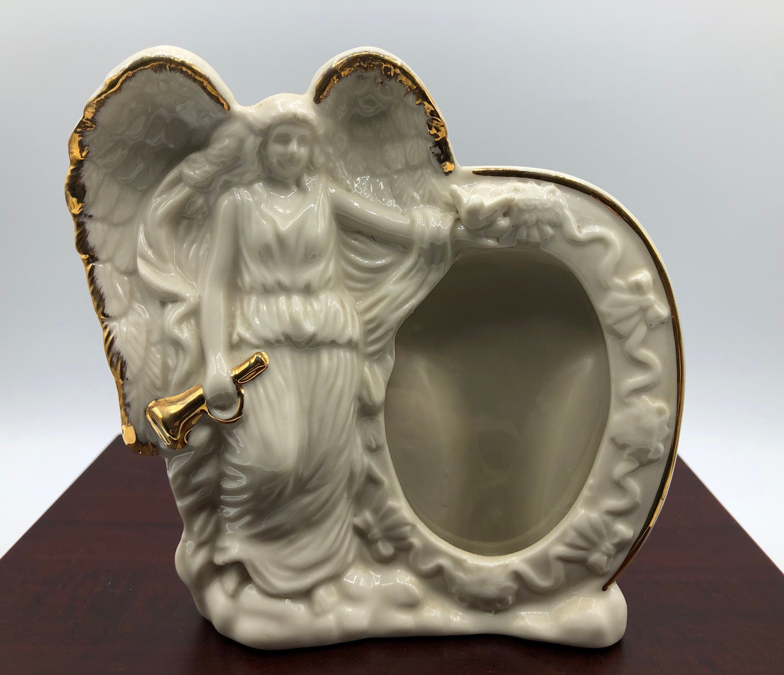 Porcelain Ceramic Angel Picture Frame. Angel Holding a Golden Horn and a  Dove. Dimensional Details and Gold Gilt Trim. 5.5 W X 5.5 High 