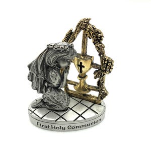 First Communion Keepsake for a Girl.  Pewter and Brass with the words First Holy Communion and a Communion Cup with Girl Kneeling in prayer.