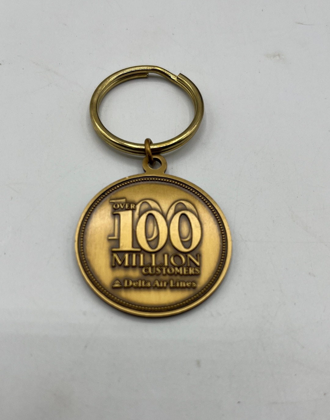 Reserved:area51様 Delta 20anniversary 1k Delta Air Lines Brass Key Ring, Commemorative of Over 100 Million